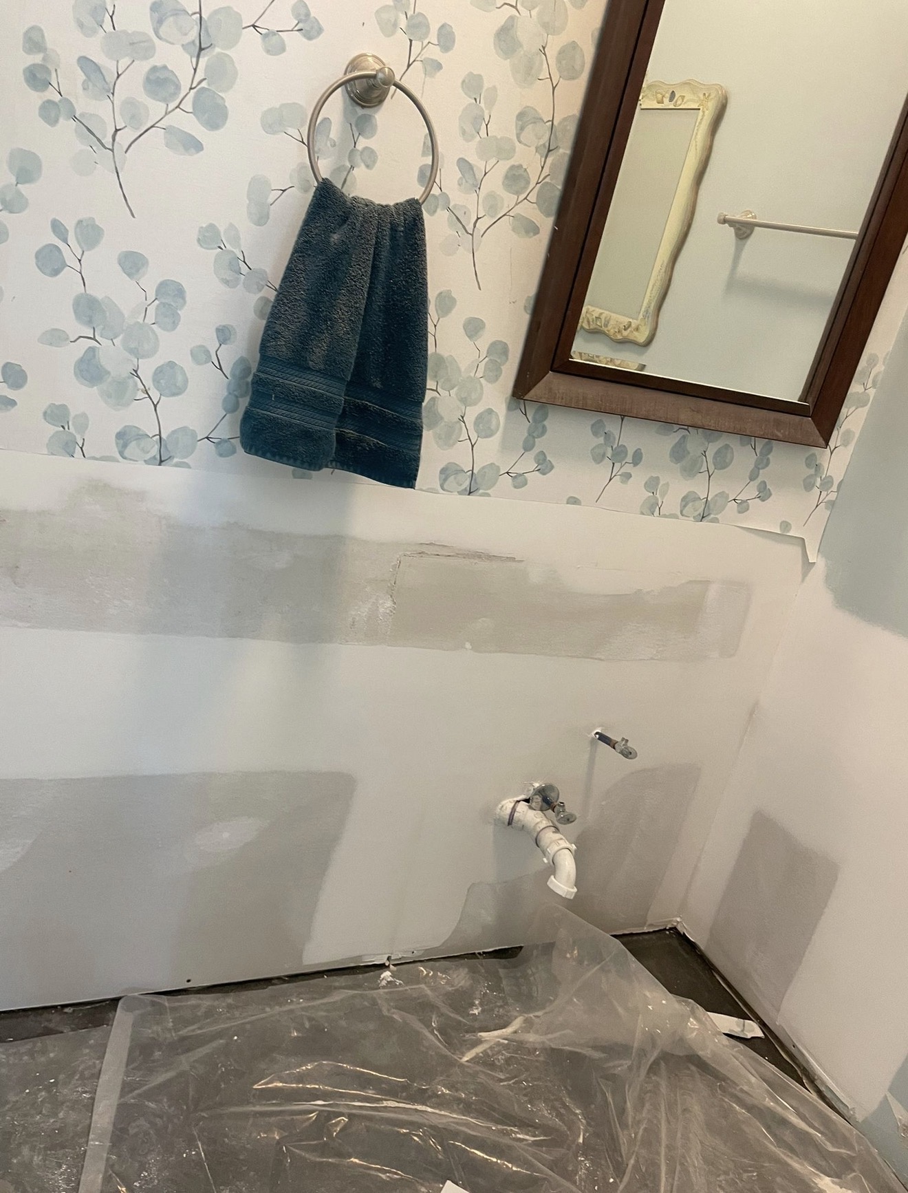 Drywall installation and repair work in progress