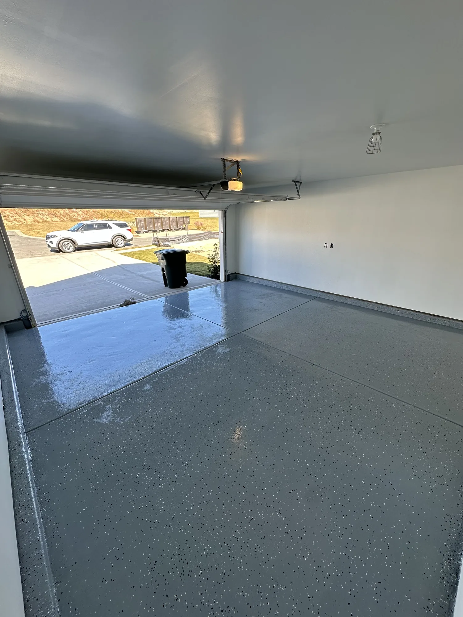 Finished garage floor protected with epoxy coating
